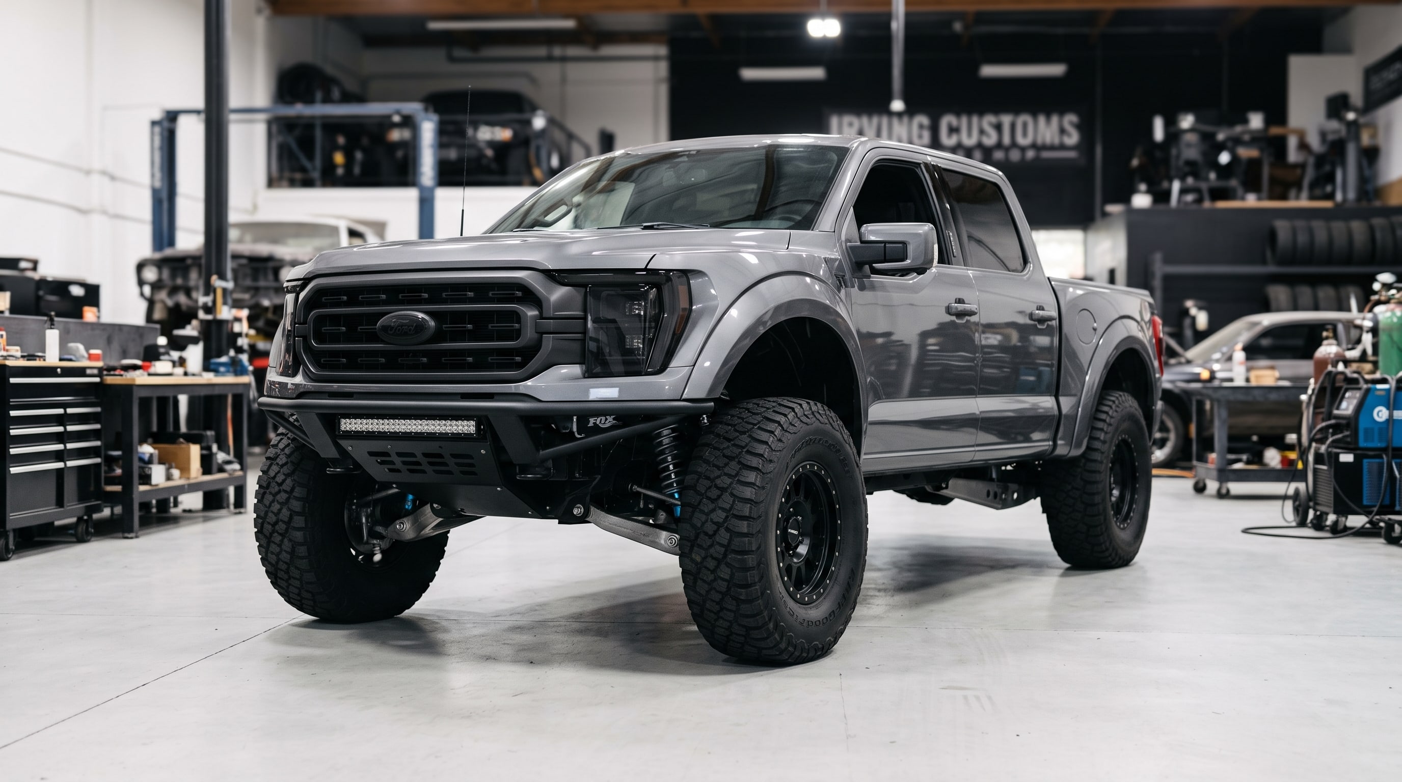 Gray 2024 Ford F-150 showing professional F150 Prerunner Builds inside a DFW custom shop — Metroplex Customs, Irving TX