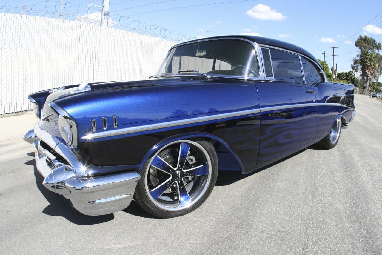 Side profile of 1957 Chevrolet Bel Air with wheels