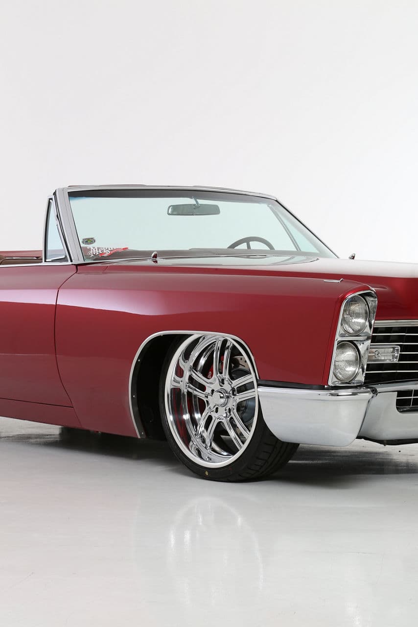 Side profile of 1967 Cadillac Coupe DeVille with wheels