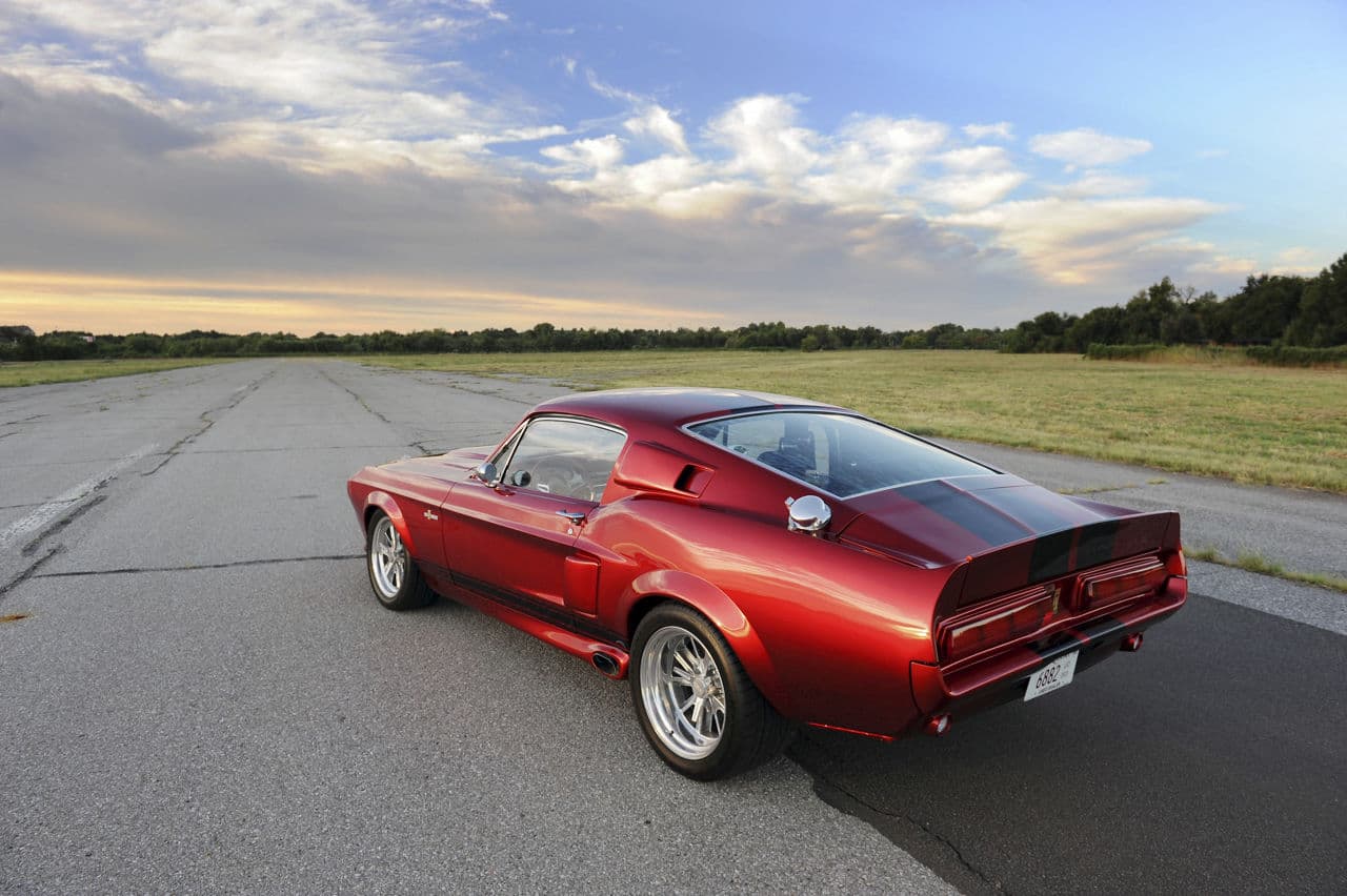 Rear view of 1967 Ford Mustang GT500 with vehicle wraps