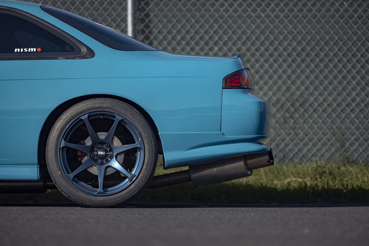 Side profile of 1995 Nissan 240SX with wheels