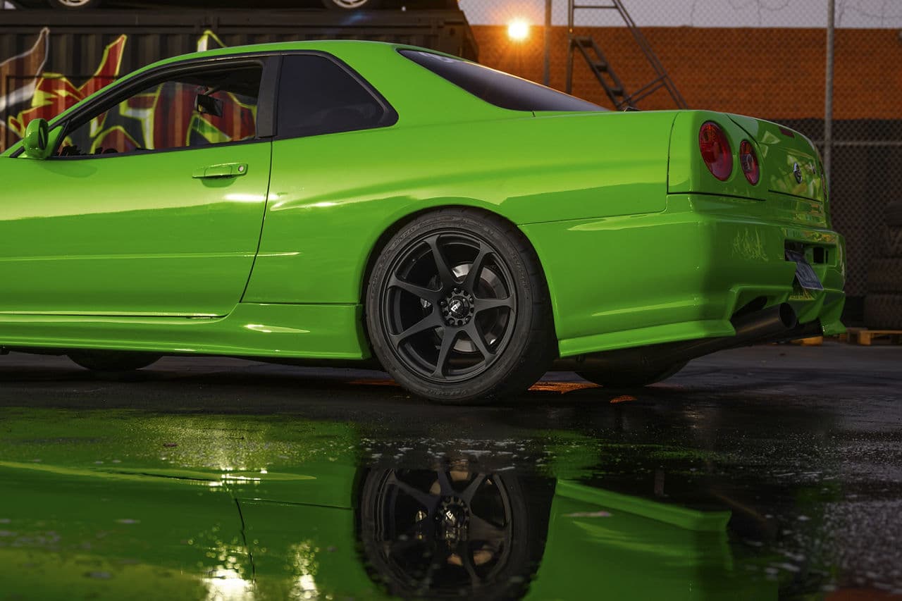 Detail view of 1995 Nissan R34 Skyline with tuner wheels