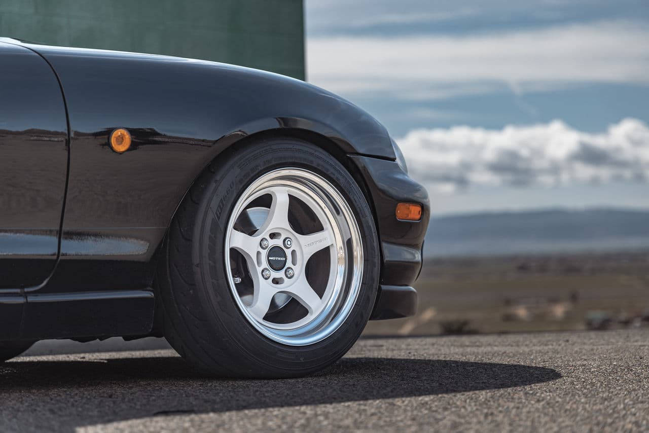 Side profile of 1998 Mazda Miata with wheels