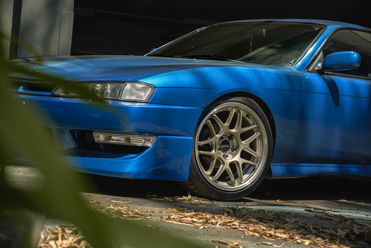 Side profile of 1998 Nissan 240SX with vehicle wraps