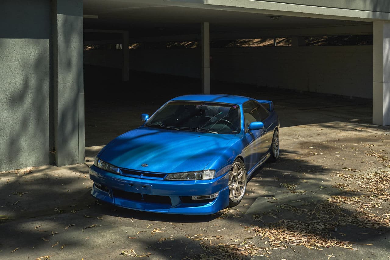 Rear view of 1998 Nissan 240SX with vehicle wraps