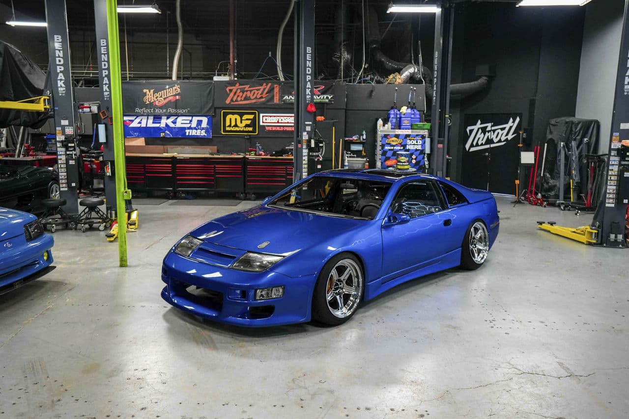 Side profile of 1999 Nissan 300ZX with tuner wheels