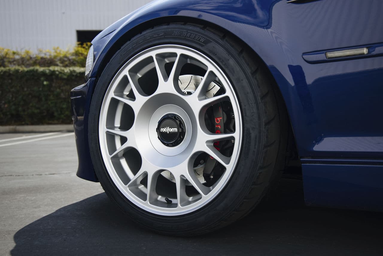 Rear view of 2002 BMW M3 with wheels