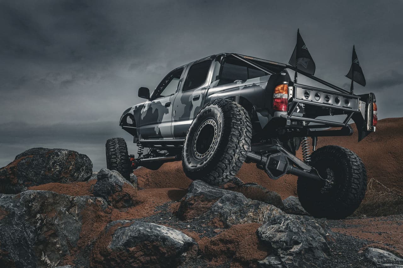 Side profile of 2003 Toyota Tacoma with wheels