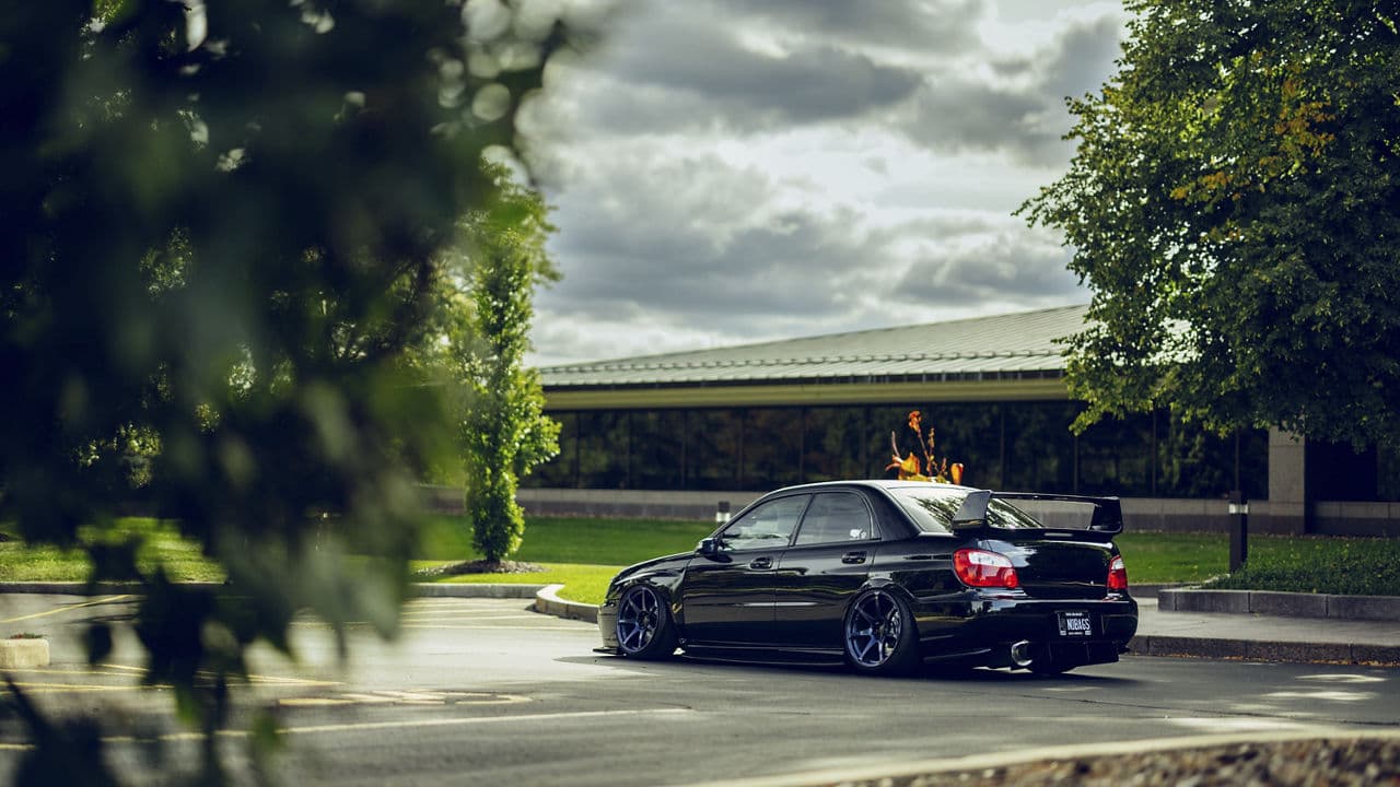 Side profile of 2005 Subaru WRX STI with wheels