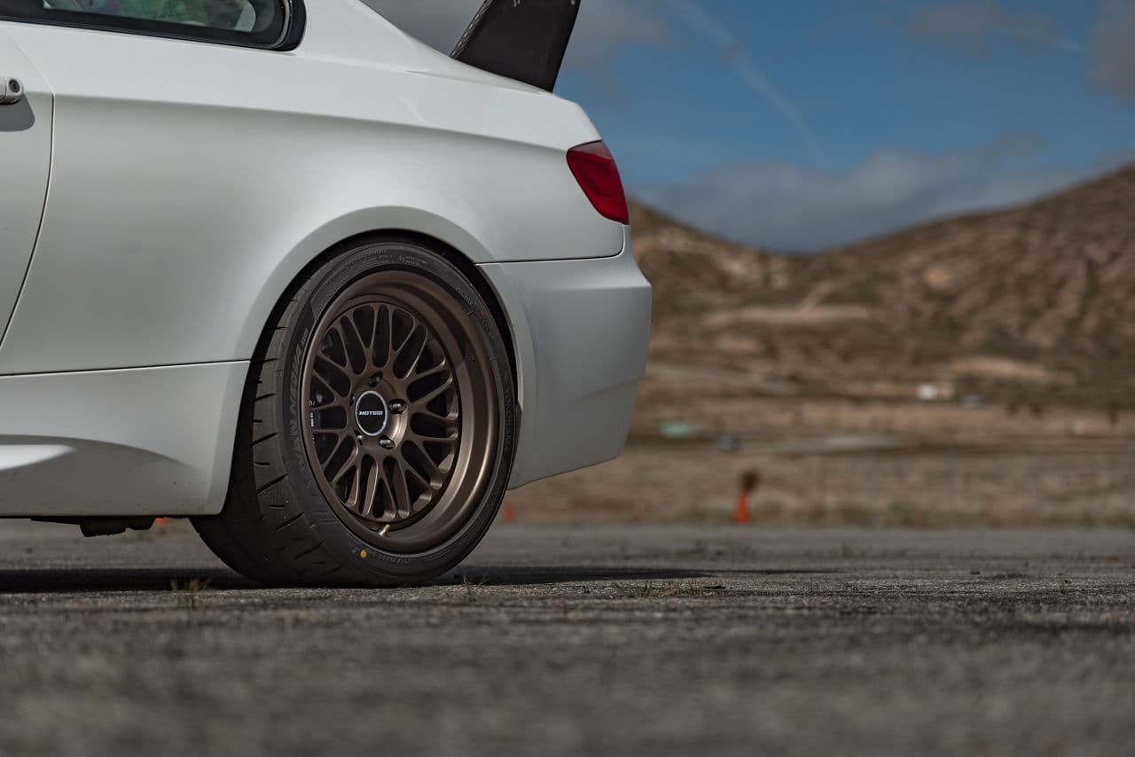 Side profile of 2010 BMW M3 with tuner wheels
