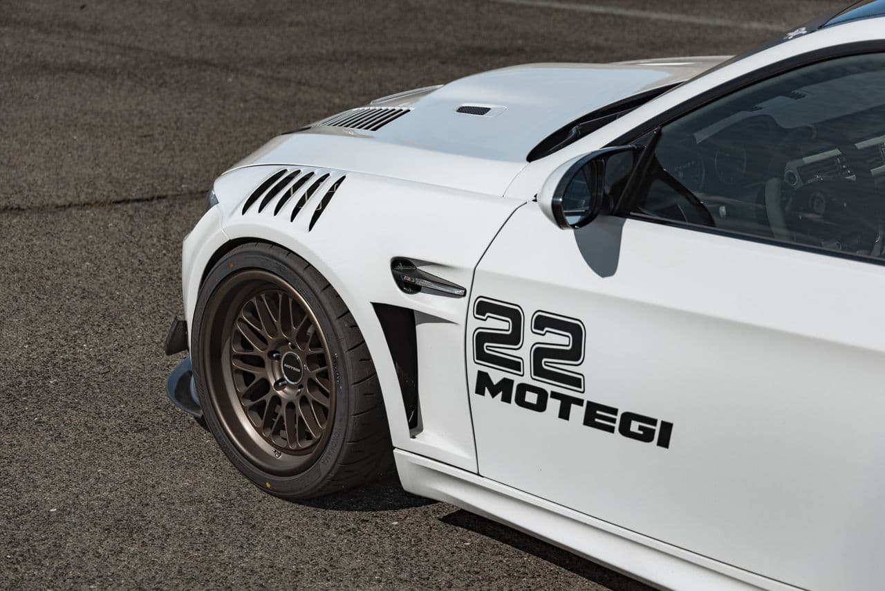 Rear view of 2010 BMW M3 with tuner wheels