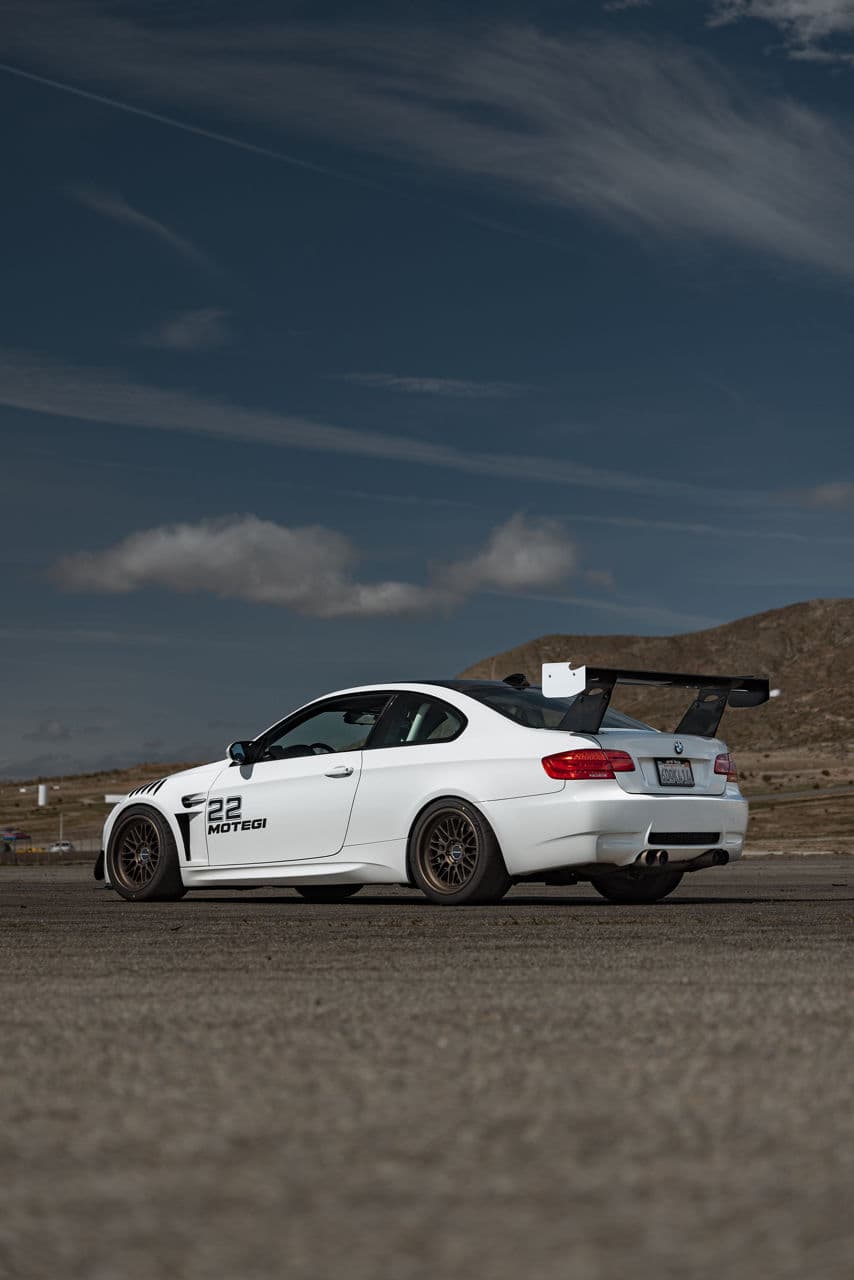 Detail view of 2010 BMW M3 with tuner wheels