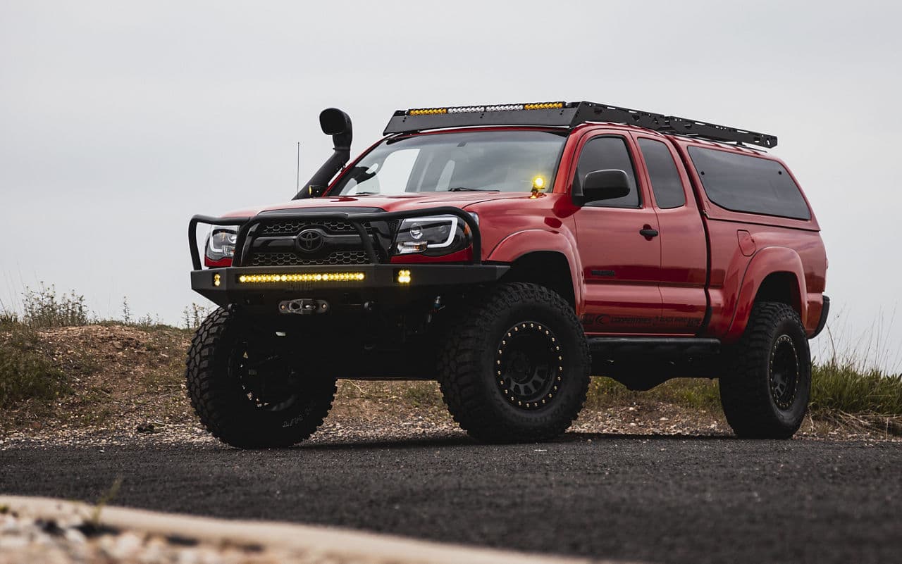 Front view of 2010 Toyota Tacoma with truck suv wheels
