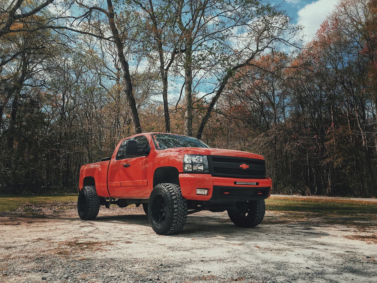 Side profile of 2012 Chevrolet Silverado 2500 with truck suv wheels