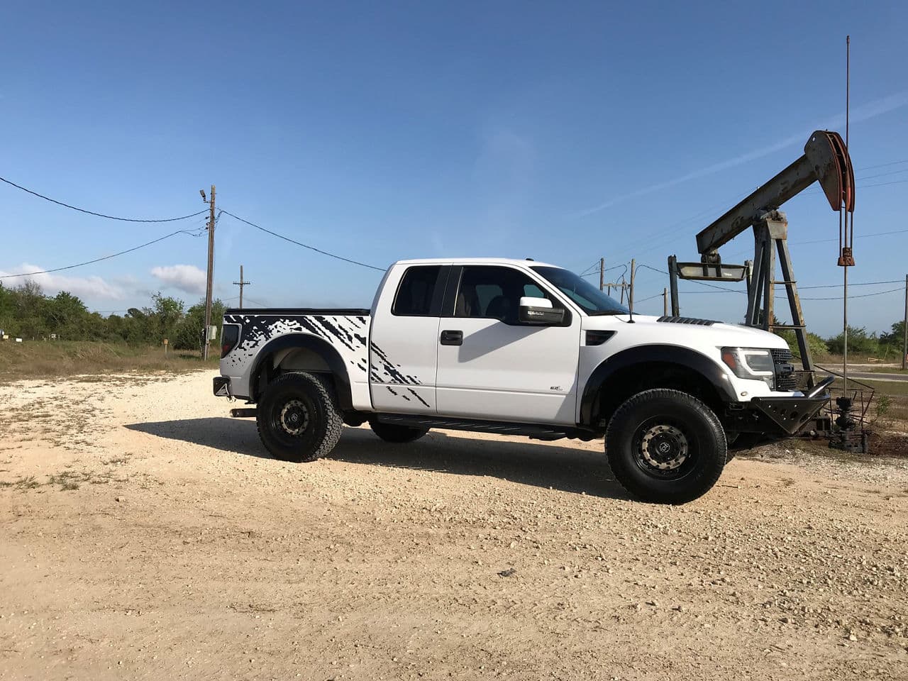 Front view of 2012 Ford F150 Raptor with truck suv wheels