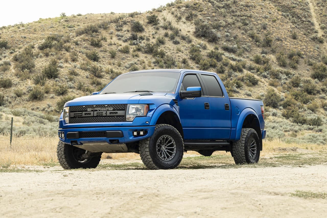 Front view of 2012 Ford F150 Raptor with truck suv wheels