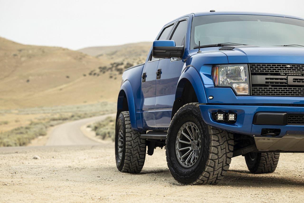Side profile of 2012 Ford F150 Raptor with truck suv wheels