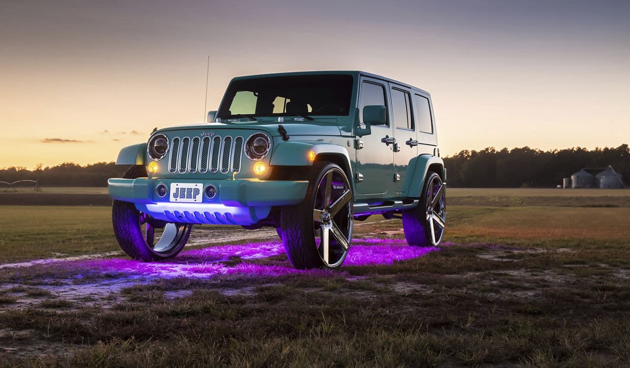 Front view of 2013 Jeep Wrangler with truck suv wheels
