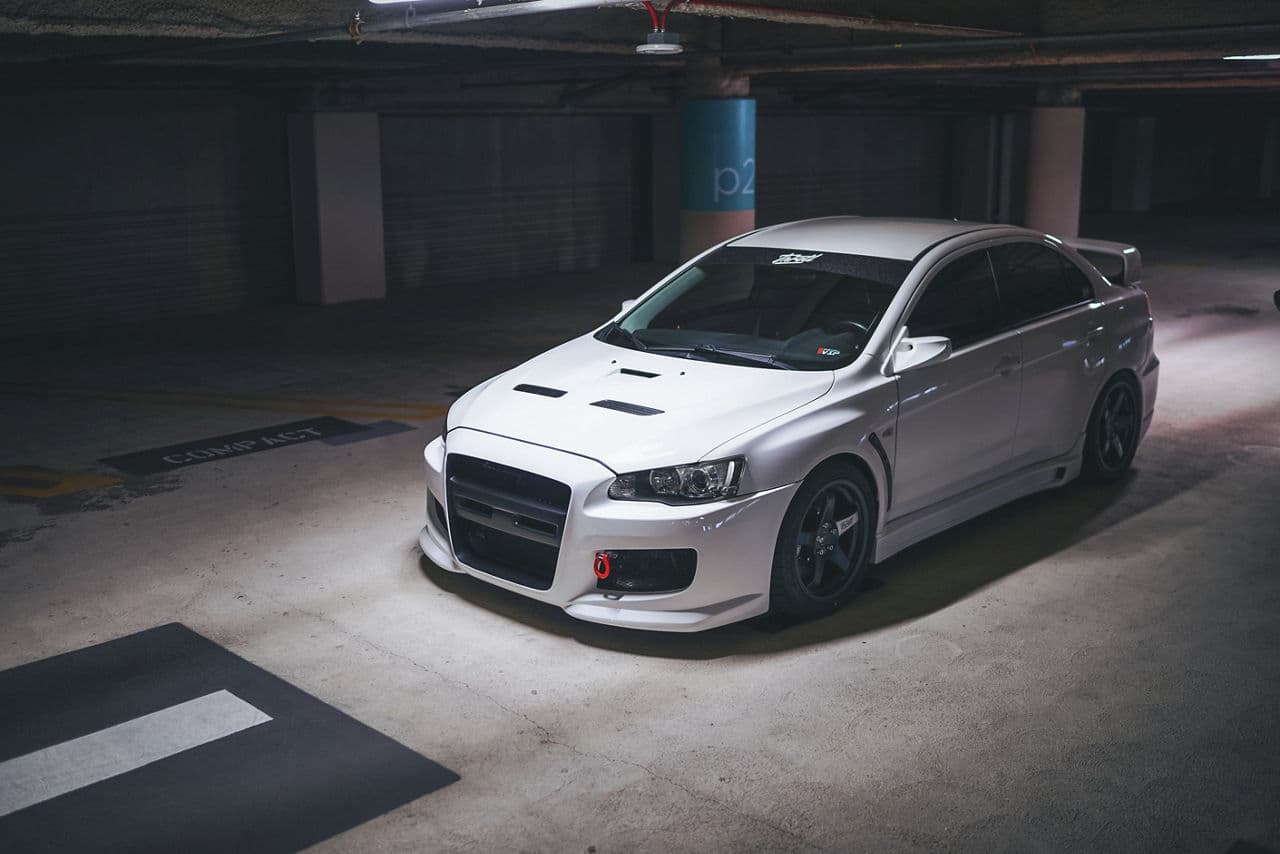 Front view of 2013 Mitsubishi Evo X with wheels