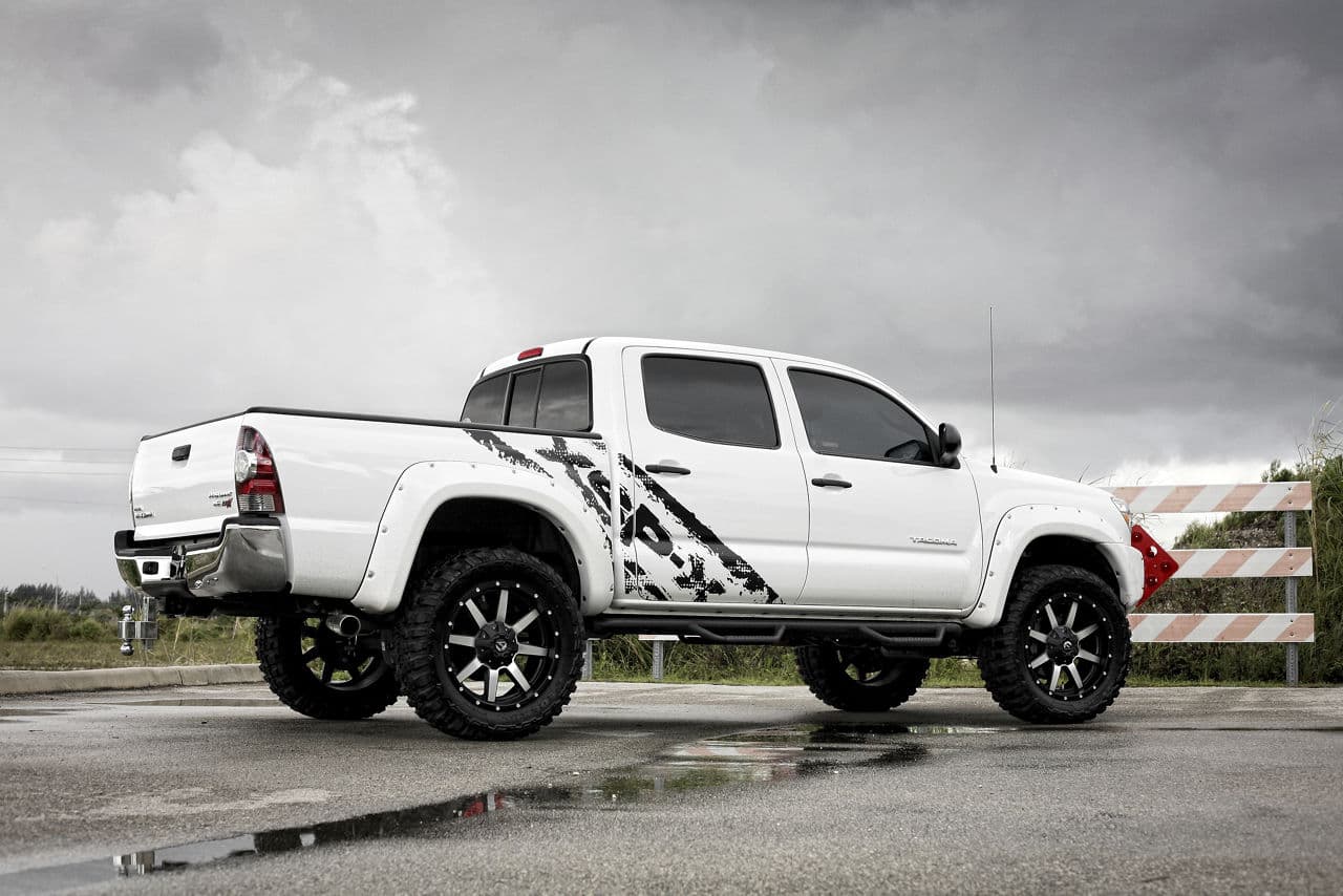 Front view of 2013 Toyota Tacoma with truck suv wheels