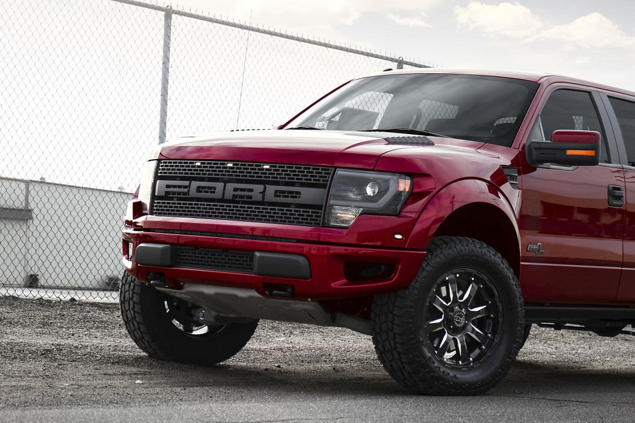 Detail view of 2014 Ford F150 Raptor with truck suv wheels