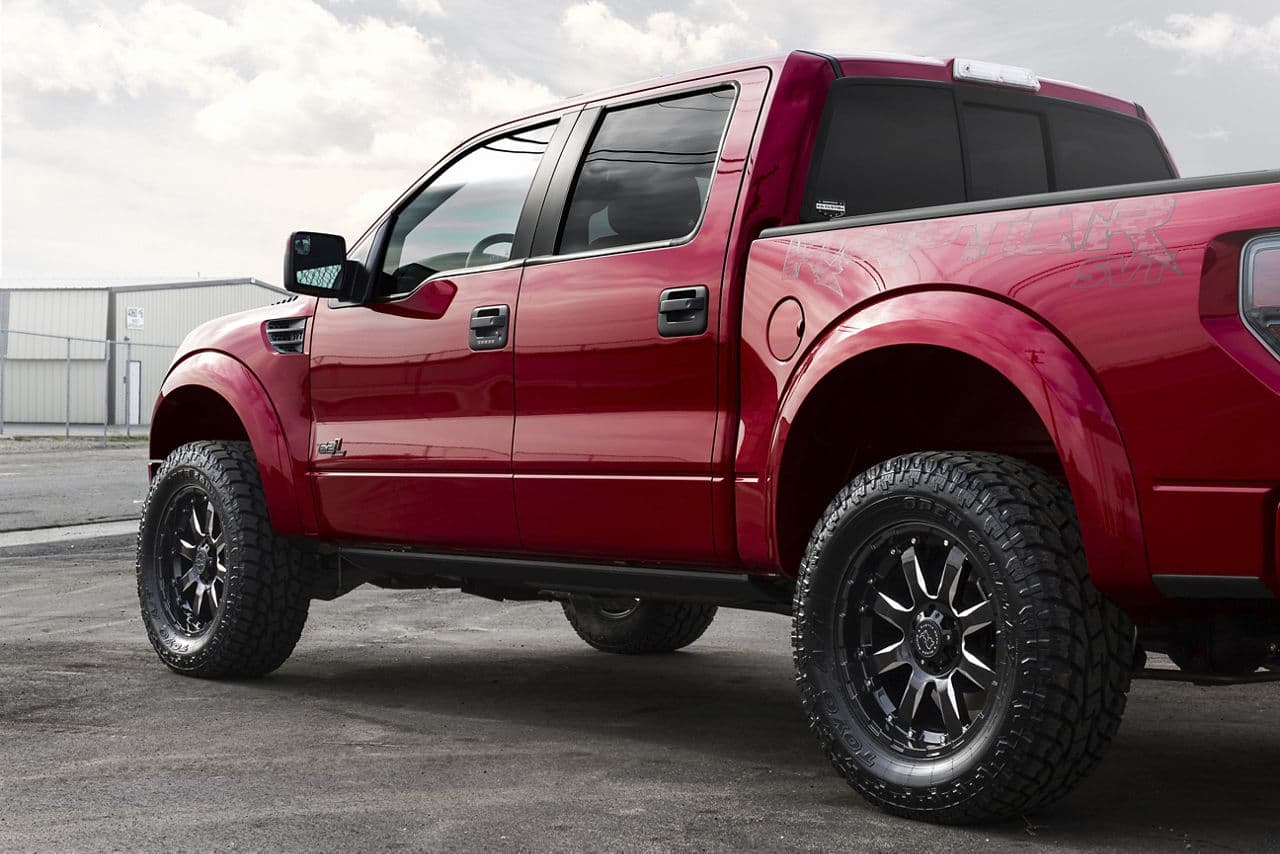 Rear view of 2014 Ford F150 Raptor with truck suv wheels