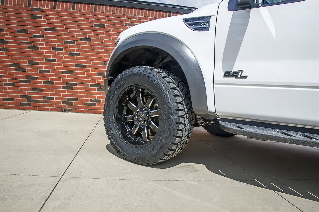 Side profile of 2014 Ford F150 Raptor with wheels
