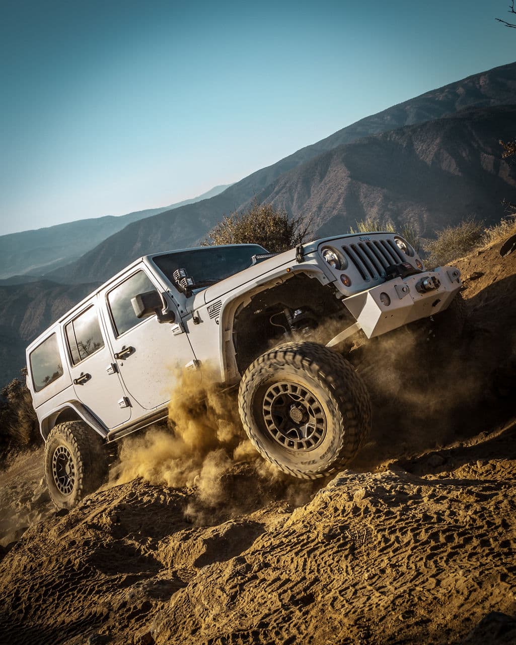 Side profile of 2014 Jeep Wrangler JKU with truck suv wheels