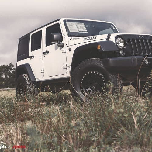 Detail view of 2014 Jeep Wrangler JKU with truck suv wheels