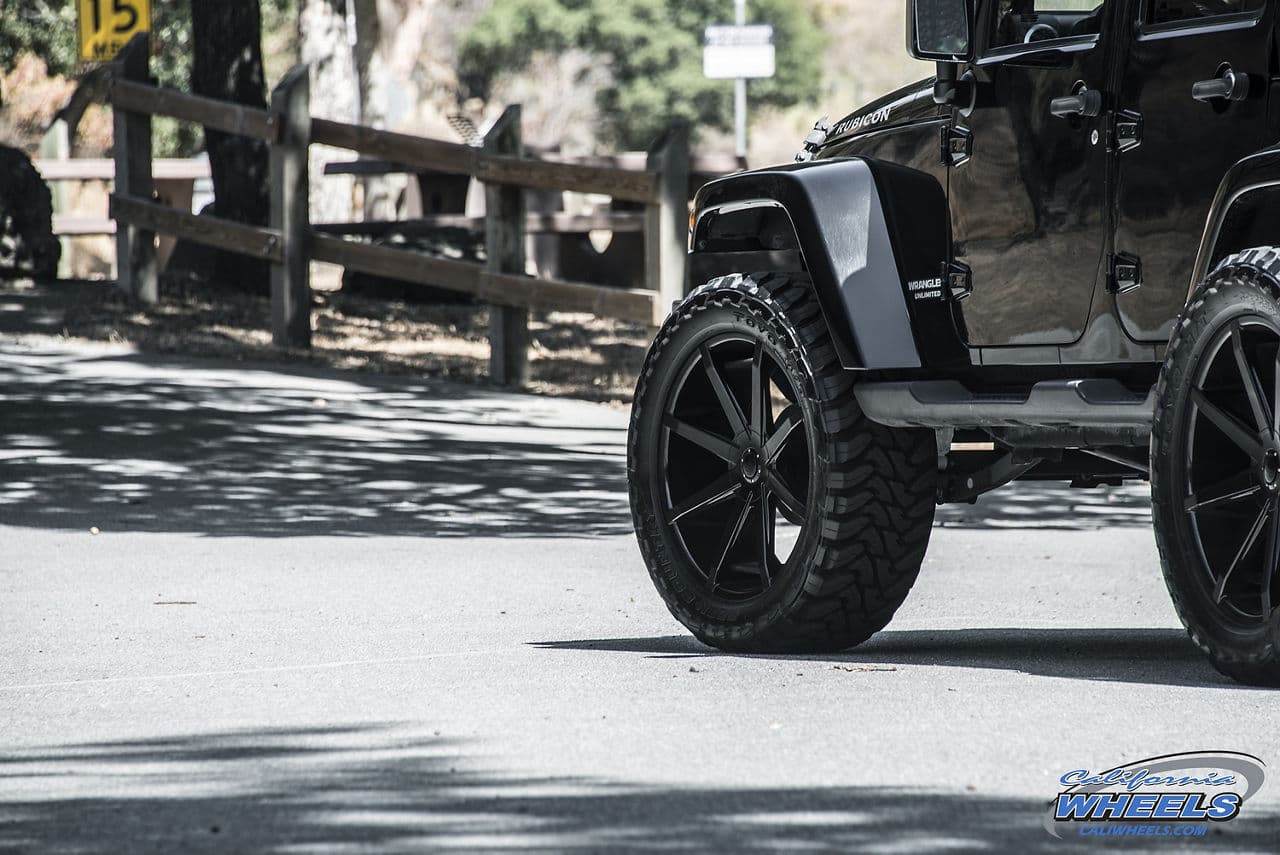 Rear view of 2014 Jeep Wrangler Rubicon with wheels