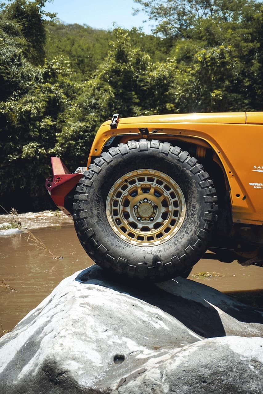 Side profile of 2014 Jeep Wrangler with truck suv wheels