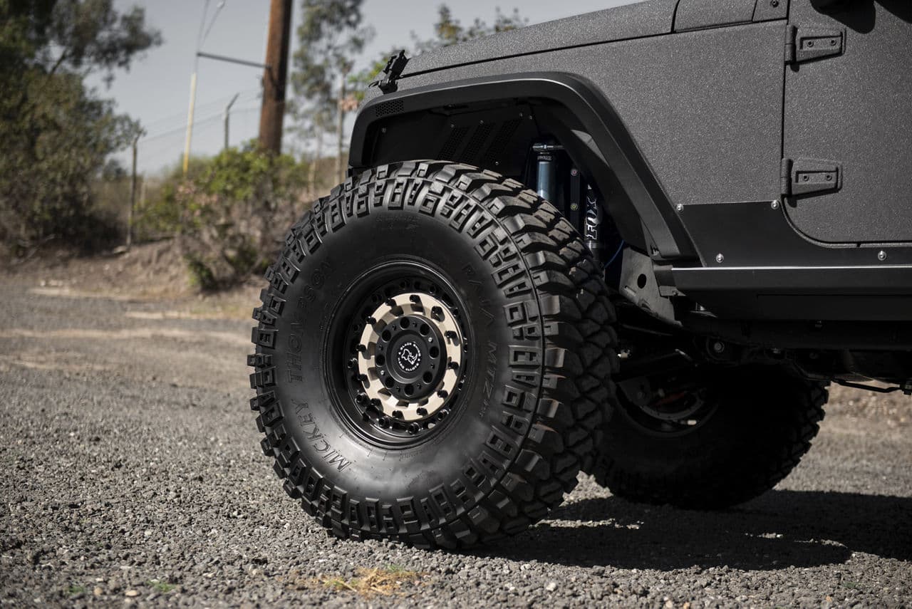 Side profile of 2014 Jeep Wrangler with wheels