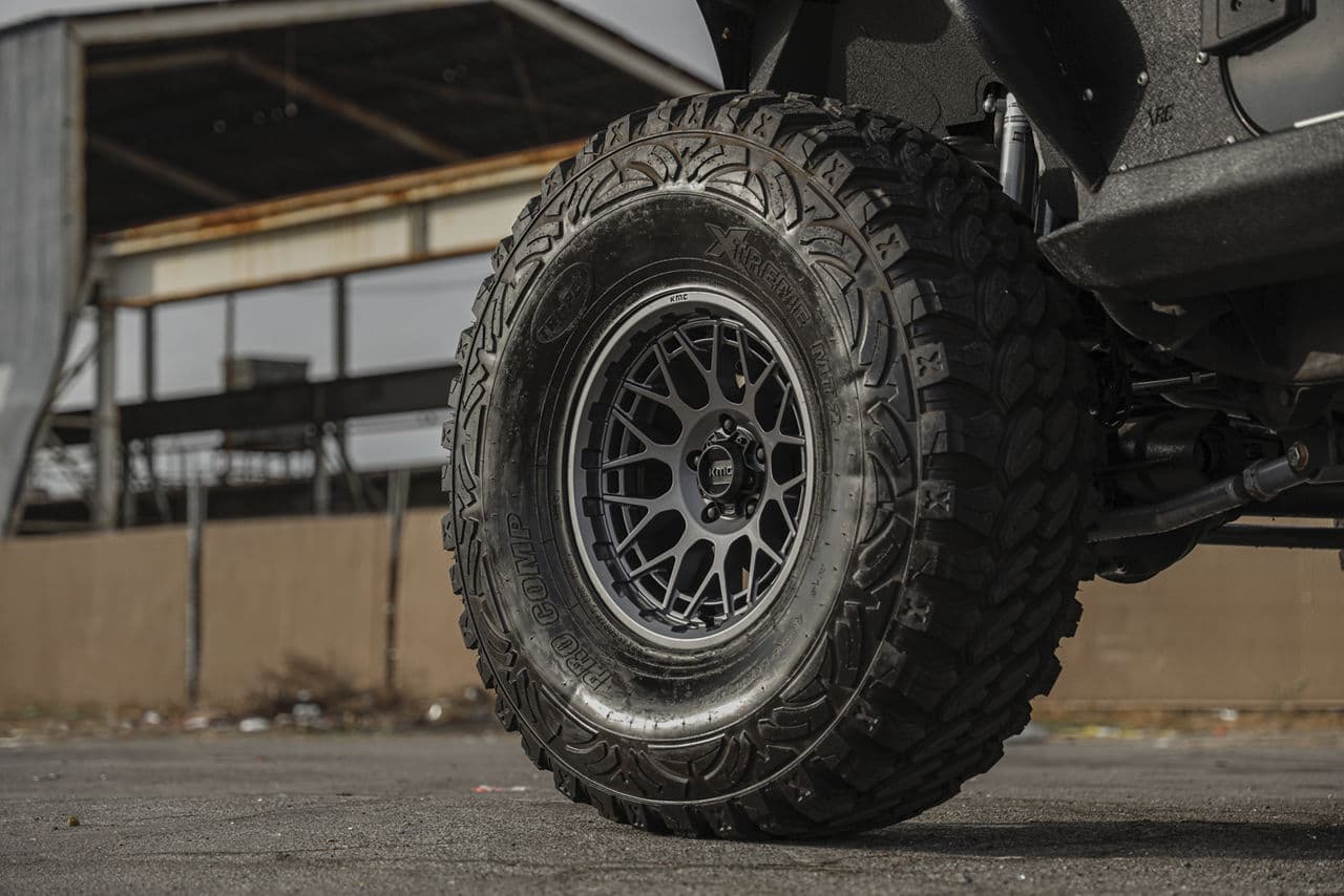 Side profile of 2014 Jeep Wrangler with wheels