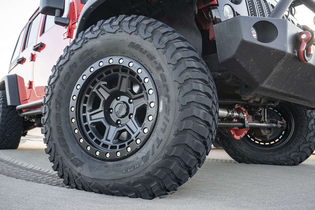Side profile of 2014 Jeep Wrangler with wheels