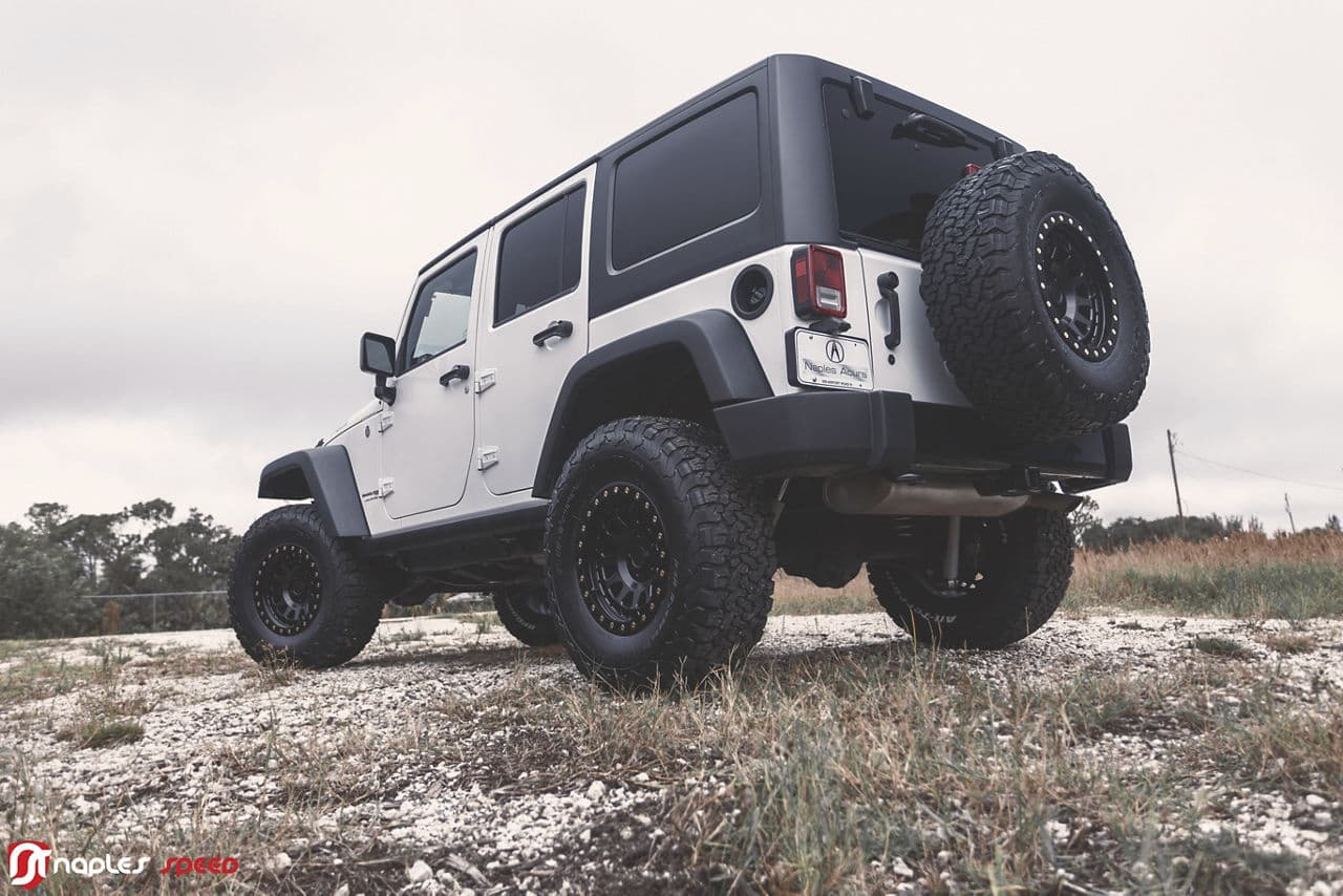 Side profile of 2014 Jeep Wrangler Willys with truck suv wheels