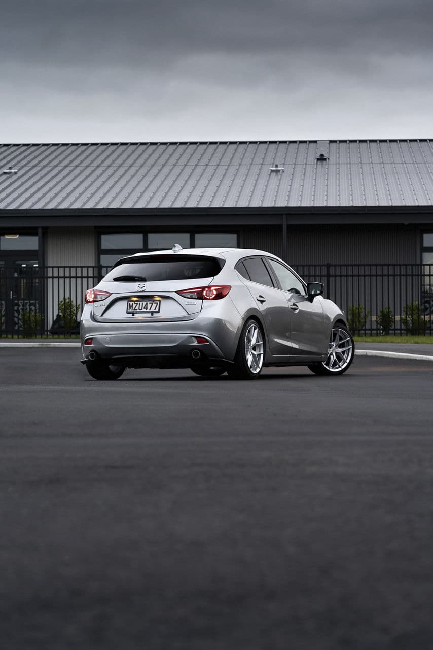 Side profile of 2014 Mazda 3 with wheels