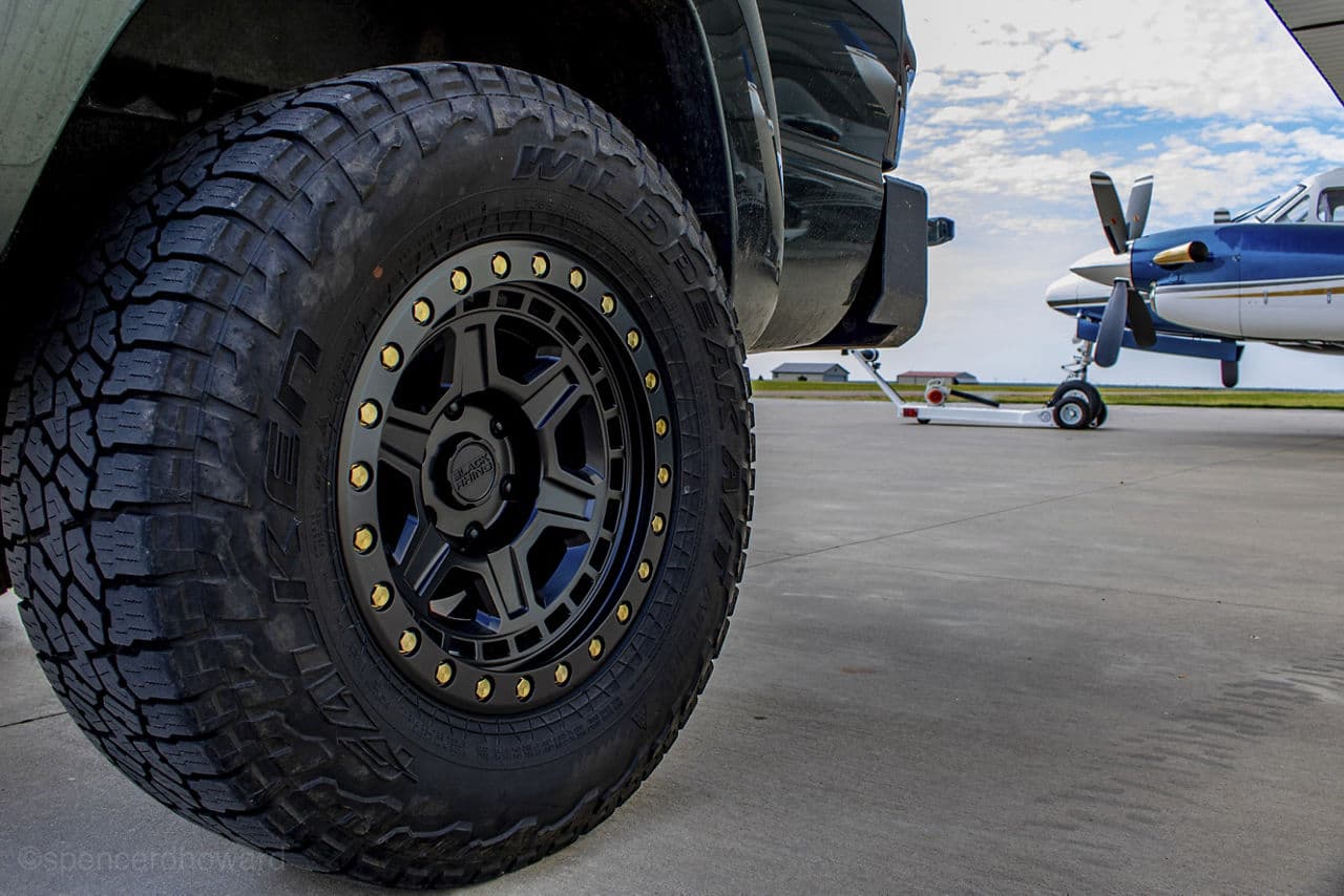 Side profile of 2014 Toyota Tacoma with truck suv wheels