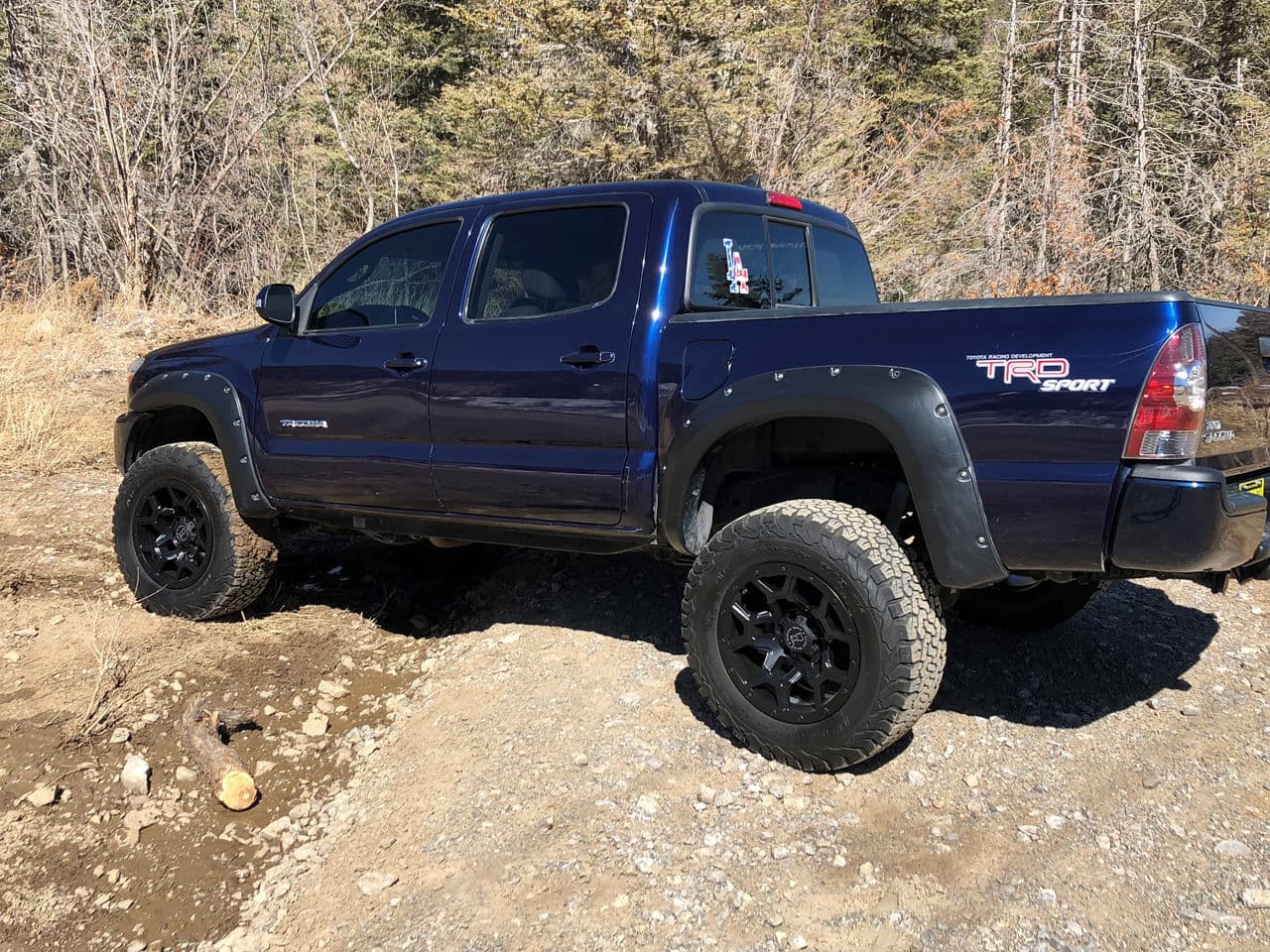 Side profile of 2014 Toyota Tacoma with wheels