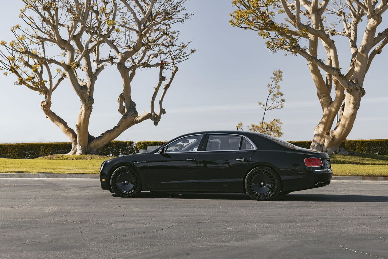 Side profile of 2015 Bentley Flying Spur with wheels