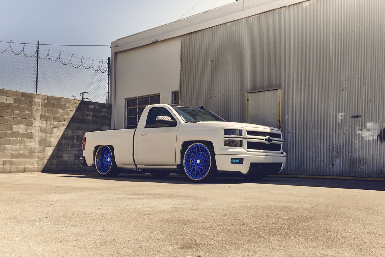 Side profile of 2015 Chevrolet Silverado with wheels