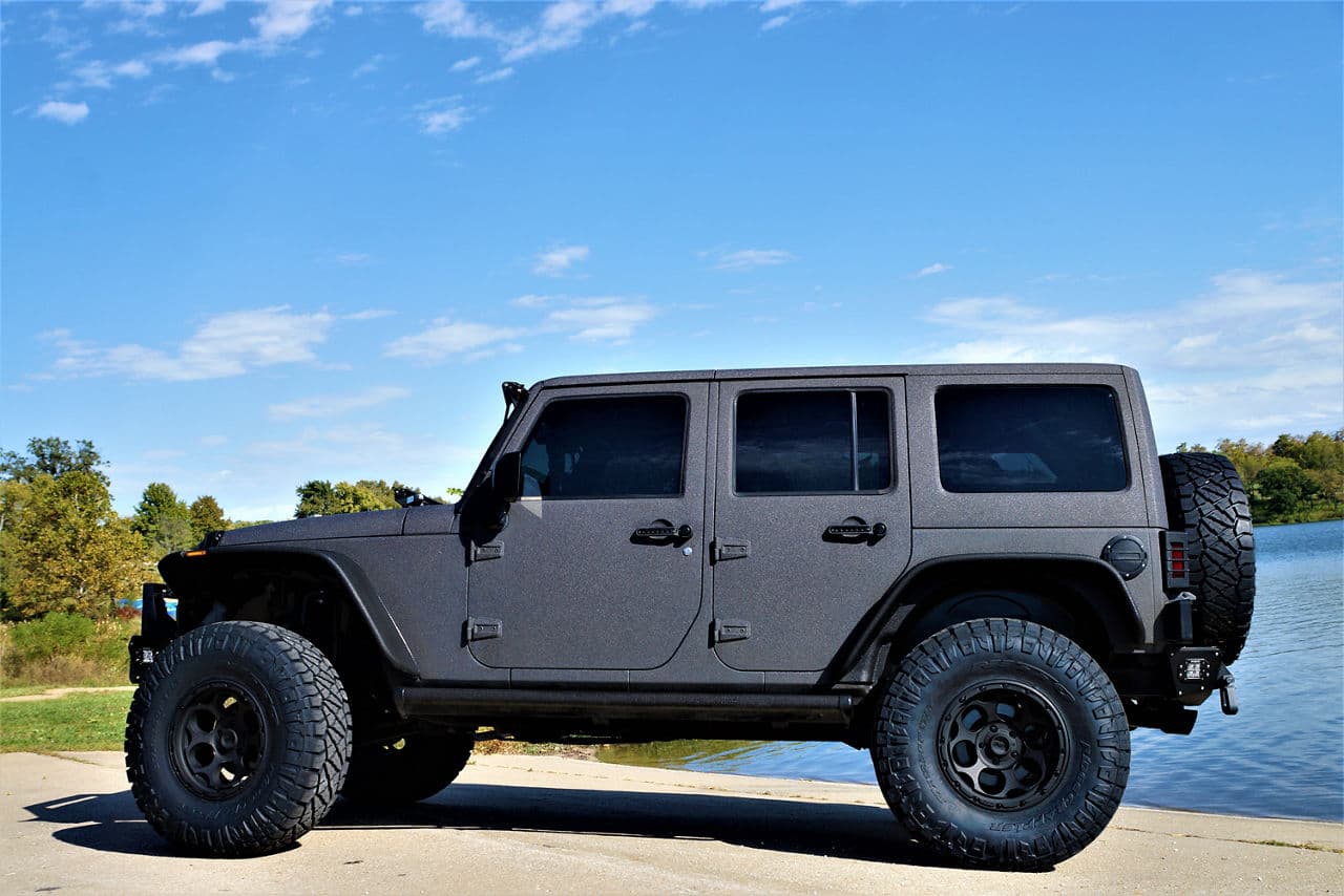 Side profile of 2015 Jeep Wrangler Rubicon with wheels