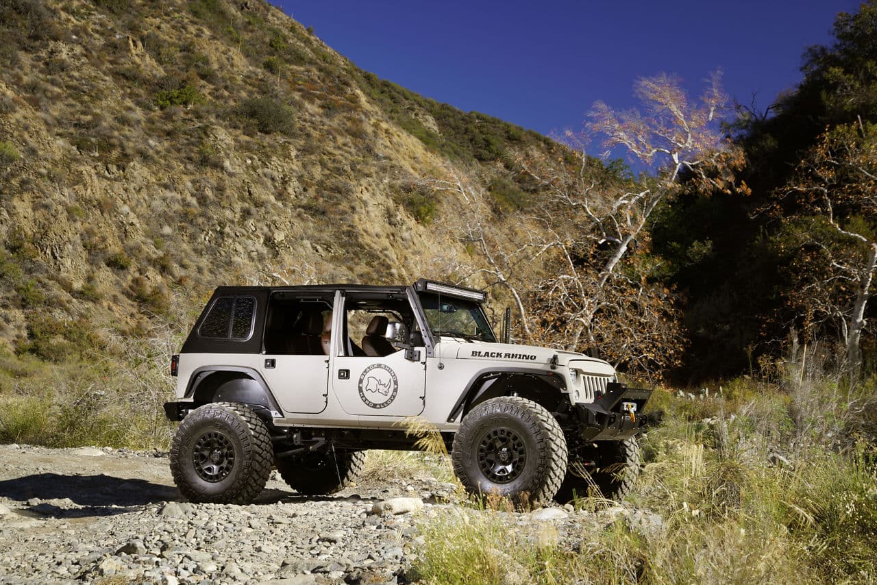 Rear view of 2016 Jeep Wrangler with truck and suv wheels