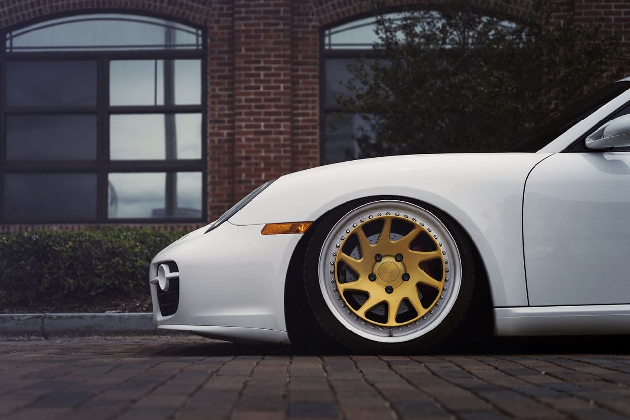 Rear view of 2016 Porsche Cayman with wheels