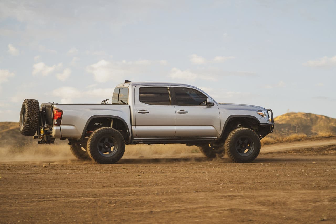 Side profile of 2016 Toyota Tacoma with wheels