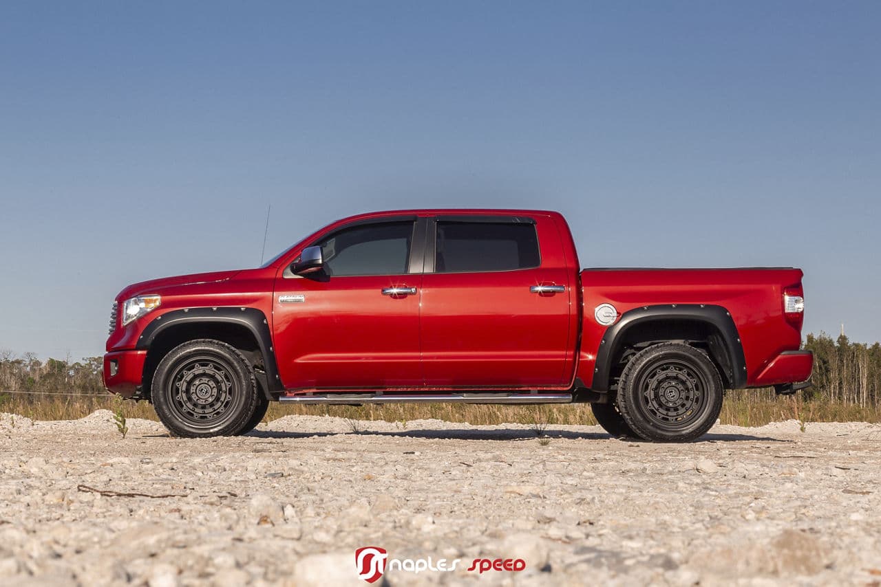 Side profile of 2016 Toyota Tundra with custom wheels and tires