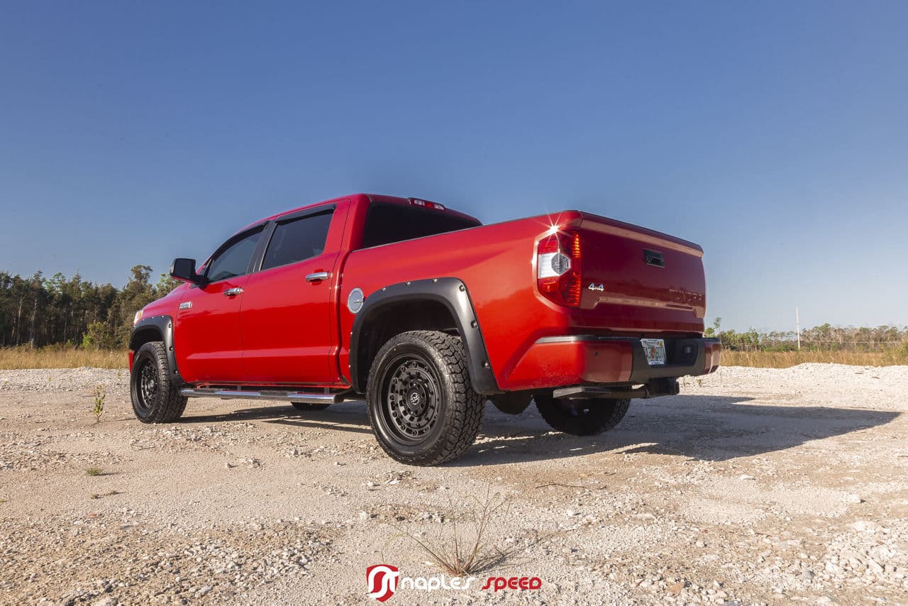 Detail view of 2016 Toyota Tundra with custom wheels and tires