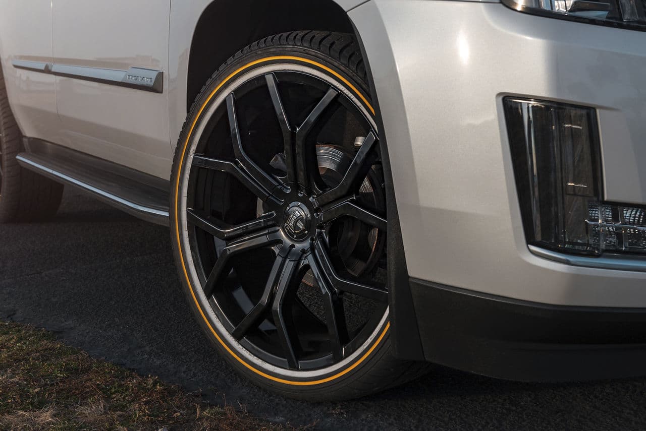 Rear view of 2017 Cadillac Escalade with wheels