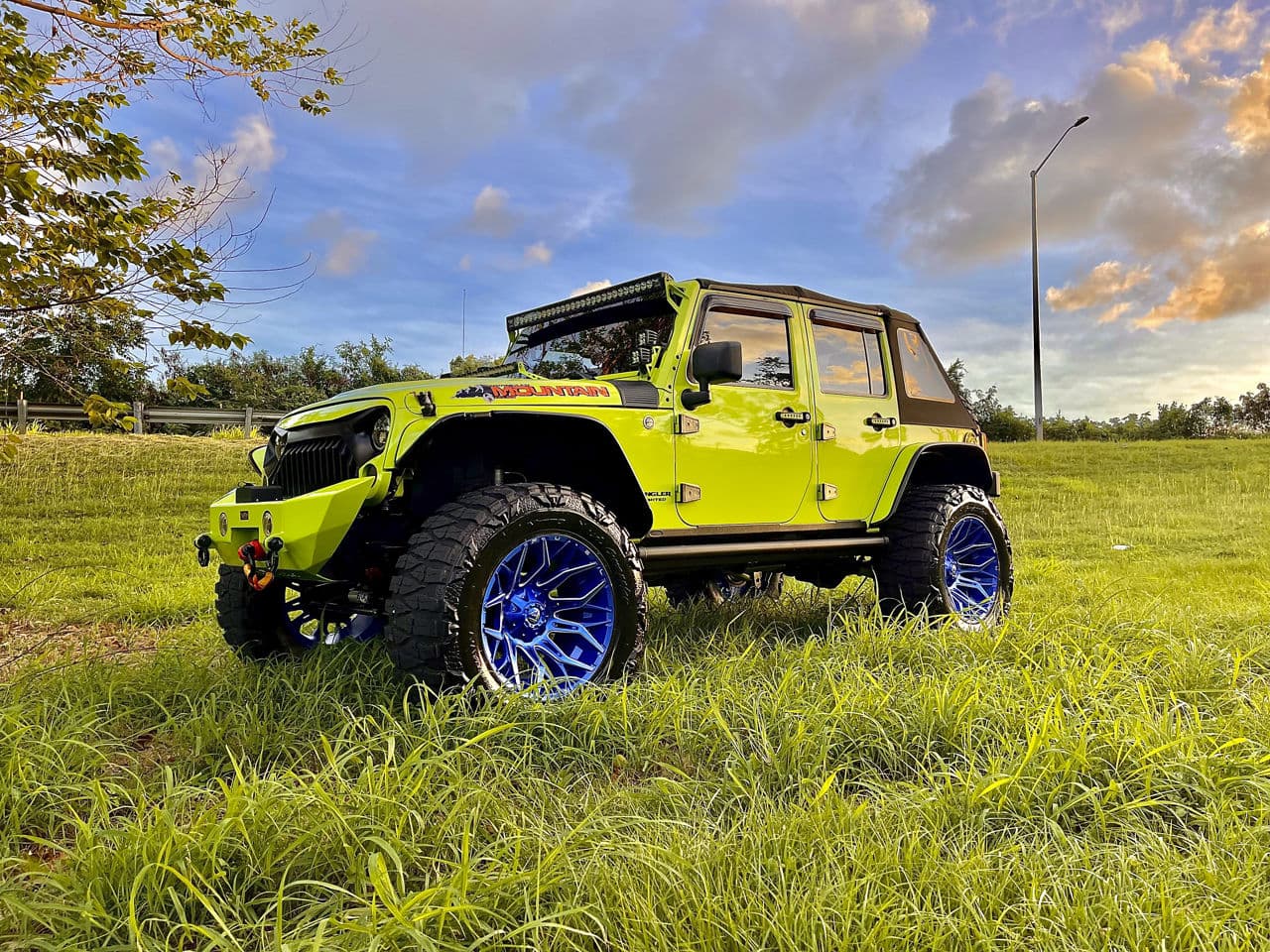 Side profile of 2018 Jeep Wrangler with truck suv wheels