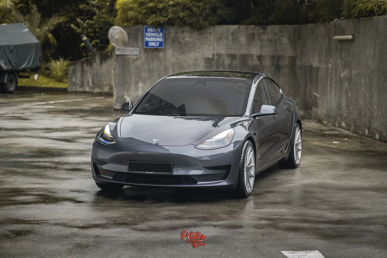 Rear view of 2018 Tesla Model 3 with wheels