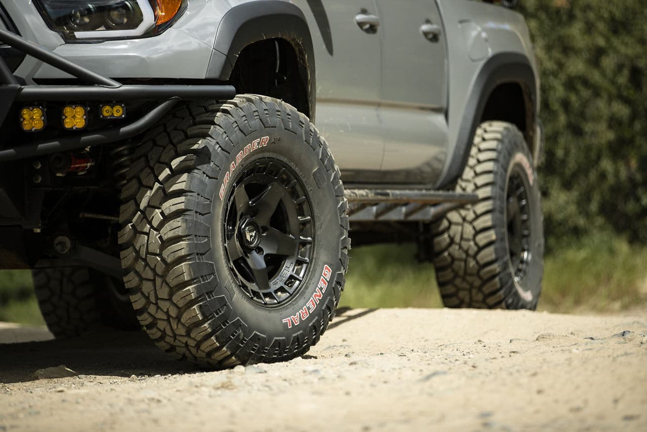 Side profile of 2018 Toyota Tacoma with wheels